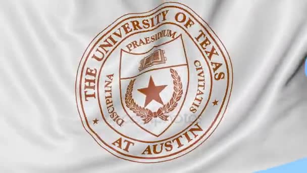 Primer plano de la bandera ondeante con emblema de la Universidad de Texas Austin, lazo sin costuras, fondo azul. Animación editorial. 4K — Vídeos de Stock