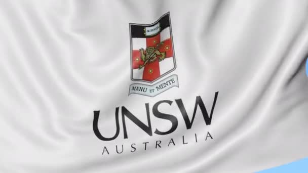 挥舞着旗子与新南威尔士大学会徽、 无缝环、 蓝色背景的特写镜头。编辑动画。4 k — 图库视频影像