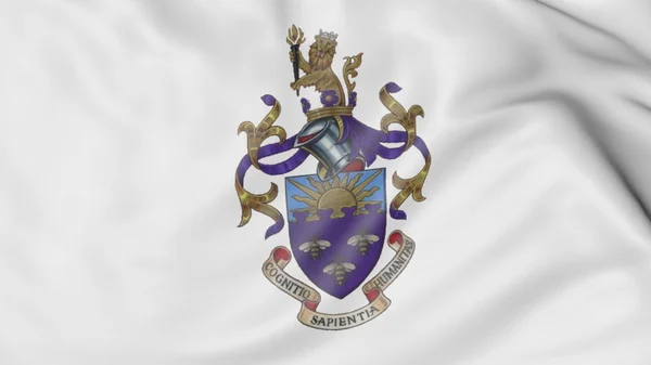 Primer plano de la bandera ondeante con la representación 3D del emblema de la Universidad de Manchester — Foto de Stock