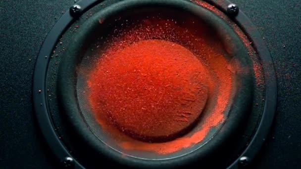 Rock inscription on orange powder over trembling loudspeaker. Super slow motion shot — Stock Video