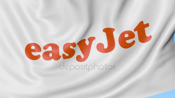 Ondeando la bandera de EasyJet contra el fondo azul del cielo, lazo sin costuras. Animación Editorial 4K — Vídeos de Stock