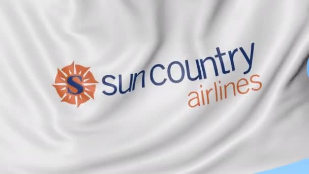 Ondeando la bandera de Sun Country Airlines contra el fondo azul del cielo, lazo sin costuras. Animación Editorial 4K — Vídeo de stock