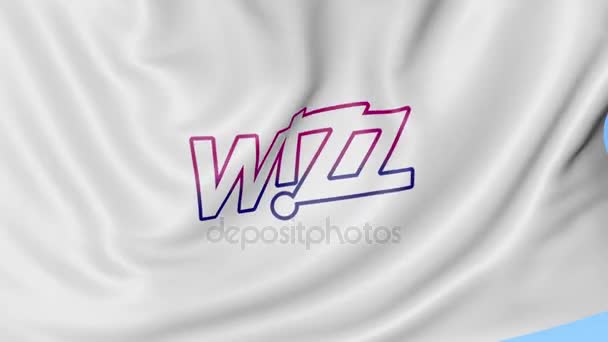 Waving flag of Wizz Air against blue sky background, seamless loop. Editorial 4K animation — Stock Video