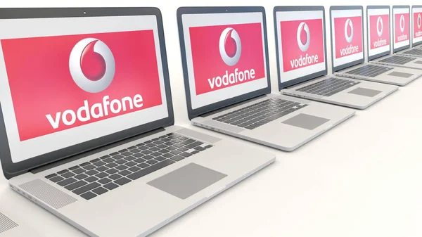 Portáteis modernos com logótipo Vodafone. Tecnologia de computador editorial conceitual renderização 3D — Fotografia de Stock
