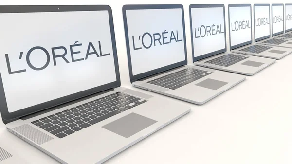 Сучасні лаптопи з Loreal логотип. Комп'ютерні технології концептуальні редакційної 3d-рендерінг — стокове фото