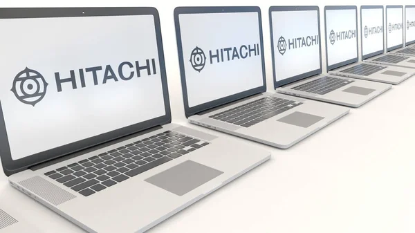 Laptopuri moderne cu logo-ul Hitachi. Tehnologia computerului redarea 3D editorială conceptuală — Fotografie, imagine de stoc