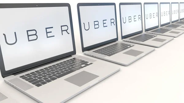 Moderne Laptops mit uber-Technologien inkl. Logo. Computertechnologie konzeptionelles redaktionelles 3D-Rendering — Stockfoto