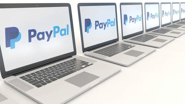 Portátiles modernos con logotipo de PayPal. Tecnología informática editorial conceptual 3D rendering — Foto de Stock
