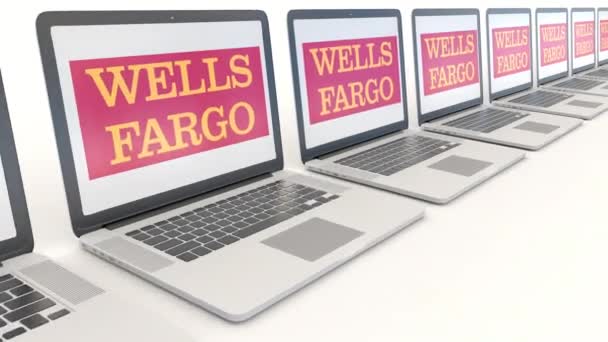 Portatili moderni con logo Wells Fargo. Tecnologia informatica concettuale editoriale clip 4K, loop senza soluzione di continuità — Video Stock