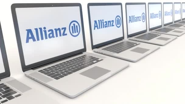 Allianz logosu ile modern dizüstü bilgisayarlar. Bilgisayar teknolojisi kavramsal editoryal 4k klip, sorunsuz döngü — Stok video