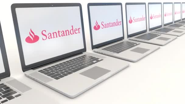 Сучасні лаптопи з логотипом Santander Serfin. Комп'ютерні технології концептуальні редакційної 4 к кліп, безшовні петлю — стокове відео