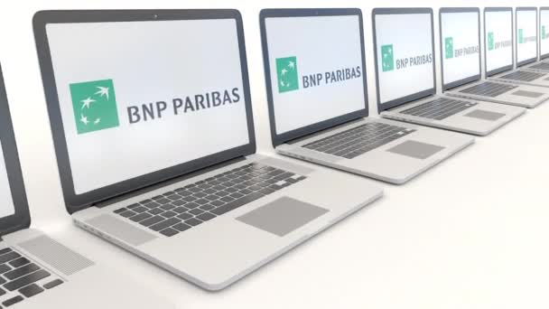 Σύγχρονες φορητοί υπολογιστές με το λογότυπο της Bnp Paribas. Υπολογιστή τεχνολογία εννοιολογική συντακτική 4k κλιπ, αδιάλειπτη βρόχο — Αρχείο Βίντεο