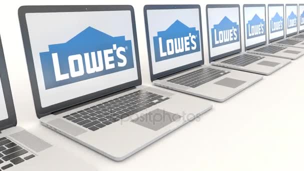 Portátiles modernos con logo Lowes. Tecnología informática editorial conceptual clip 4K, bucle sin costura — Vídeos de Stock
