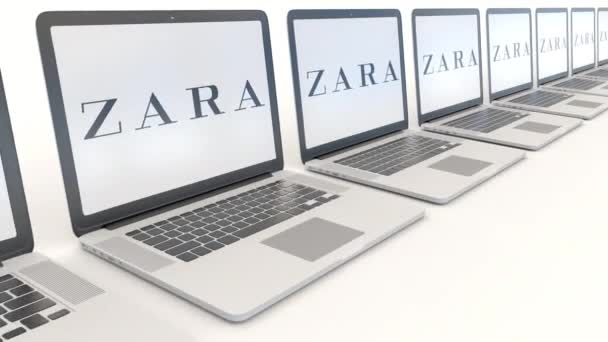 Modern laptops with Zara logo. Computer technology conceptual editorial 4K clip, seamless loop — Stock Video