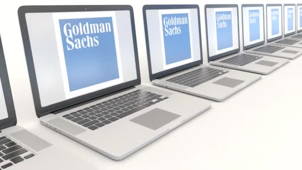 Modern laptopok a Goldman Sachs Group, Inc. logóval. Számítógép technológia fogalmi szerkesztői 4k klip, varrat nélküli hurok — Stock videók