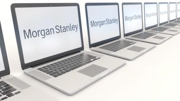 Moderní notebooky s logem Morgan Stanley vč. Počítač technika koncepční redakční 4k klip, bezešvé smyčka — Stock video
