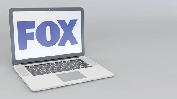 Laptop com logotipo Fox Broadcasting Company. Tecnologia de computador editorial conceitual renderização 3D — Fotografia de Stock