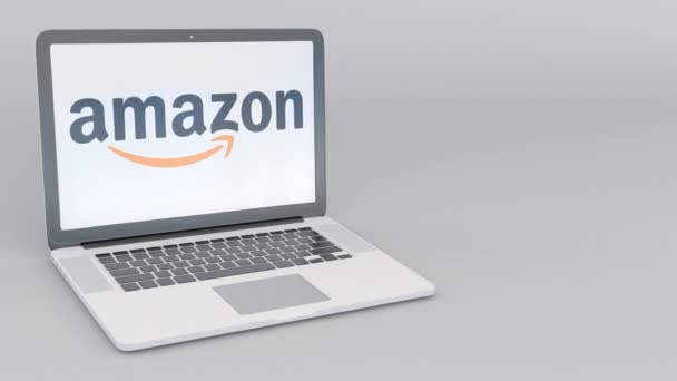 Roterende openen en sluiten van laptop met Amazon.com logo. Computer technologie conceptuele redactionele 4k clip — Stockvideo