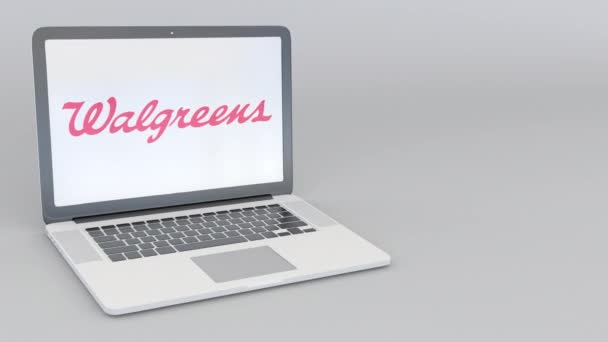 Roterende openen en sluiten van laptop met Walgreens logo. Computer technologie conceptuele redactionele 4k clip — Stockvideo