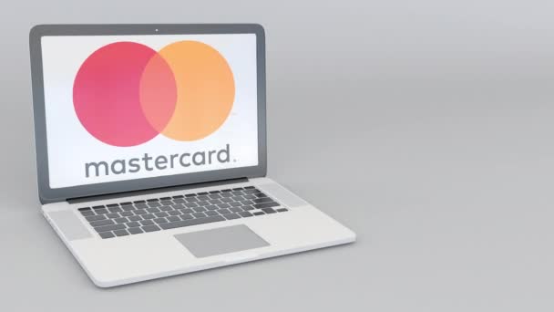 Forgó nyitó és záró laptop Mastercard logóval. Számítógép technológia fogalmi szerkesztői 4k klip — Stock videók