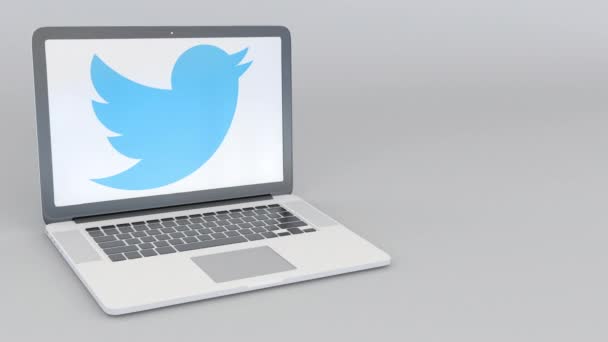 Twitter, Inc. 로고와 함께 노트북을 개폐 회전 합니다. 컴퓨터 기술 개념 편집 4 k 클립 — 비디오