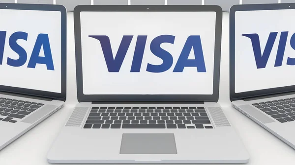 Ноутбуки с логотипом Visa Inc. на экране. Концептуальная редакционная 3D рендеринг компьютерных технологий — стоковое фото