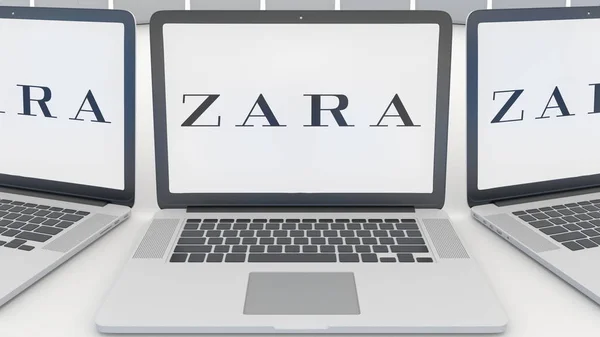 Ноутбуки з Zara логотип на екрані. Комп'ютерні технології концептуальні редакційної 3d-рендерінг — стокове фото