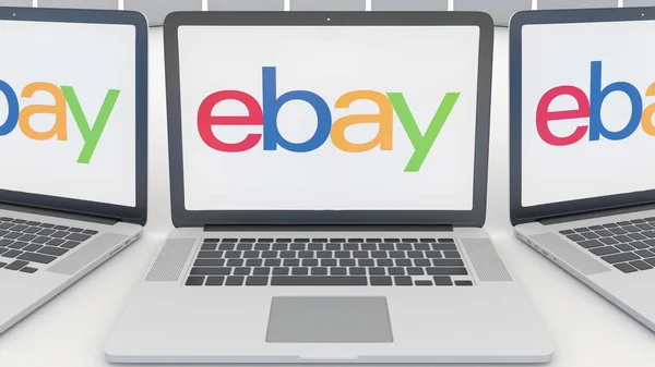 Portátiles con el logotipo de eBay Inc. en la pantalla. Tecnología informática editorial conceptual 3D rendering —  Fotos de Stock