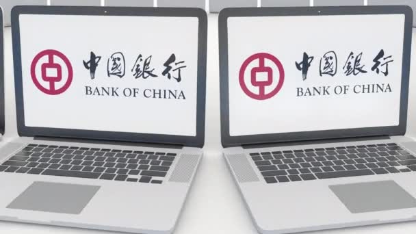 Laptopok, a Bank of China logó a képernyőn. Számítógép technológia fogalmi szerkesztői 4k klip, varrat nélküli hurok — Stock videók