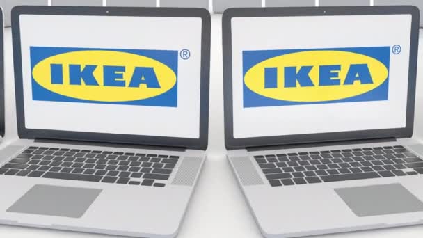 Laptops-val Ikea logó a képernyőn. Számítógép technológia fogalmi szerkesztői 4k klip, varrat nélküli hurok — Stock videók