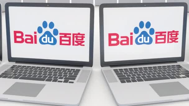 Portátiles con logotipo Baidu en la pantalla. Tecnología informática editorial conceptual clip 4K, bucle sin costura — Vídeos de Stock