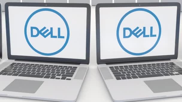 Ноутбуки с логотипом Dell Inc. на экране. Концептуальная редакционная работа по компьютерным технологиям 4К клип, бесшовный цикл — стоковое видео