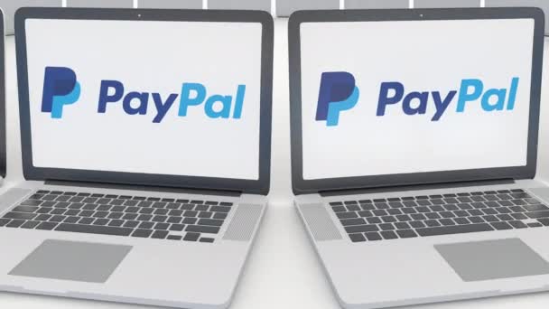 Portatili con logo PayPal sullo schermo. Tecnologia informatica concettuale editoriale clip 4K, loop senza soluzione di continuità — Video Stock