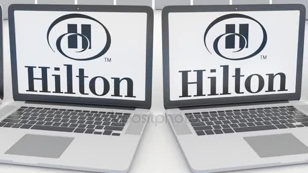 ヒルトン ホテル リゾートのロゴ画面のノート パソコン。コンピューター技術概念の編集 4 k クリップ、シームレス ループ — ストック動画