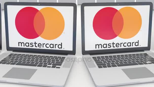 Laptops met Mastercard-logo op het scherm. Computer technologie conceptuele redactionele 4k clip, naadloze loops — Stockvideo