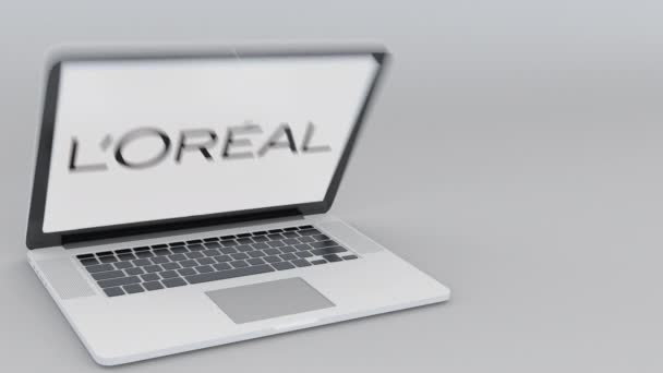 Das Öffnen und Schließen des Laptops mit dem lorealen Logo auf dem Bildschirm. Computertechnologie konzeptioneller redaktioneller 4k-Clip — Stockvideo