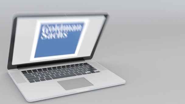Ανοίγματος και κλεισίματος το laptop με το λογότυπο της Goldman Sachs Group, Inc. στην οθόνη. Υπολογιστή τεχνολογία εννοιολογική συντακτική 4k κλιπ — Αρχείο Βίντεο