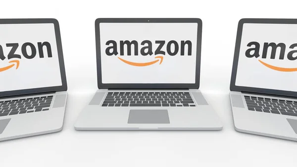 Buku catatan dengan logo Amazon.com di layar. Penerjemahan 3D konseptual teknologi komputer — Stok Foto