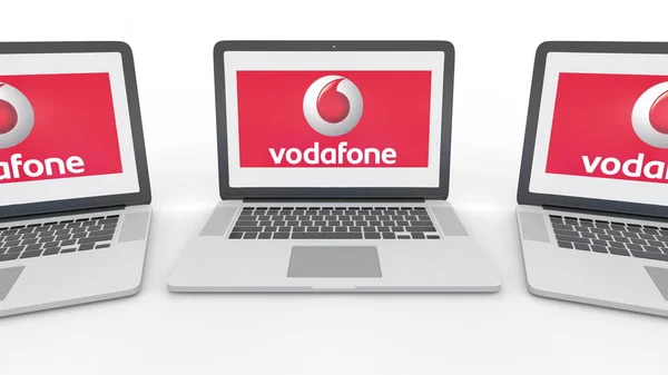Notebooky s logem Vodafone na obrazovce. Počítačové technologie koncepční redakční 3d vizualizace — Stock fotografie