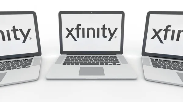 Cuadernos con el logotipo de Xfinity en la pantalla. Tecnología informática editorial conceptual 3D rendering — Foto de Stock