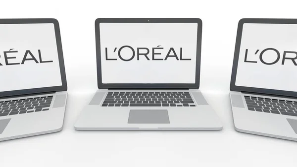 Блокноти з Loreal логотип на екрані. Комп'ютерні технології концептуальні редакційної 3d-рендерінг — стокове фото