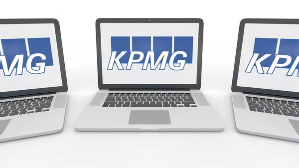 Notebook ile Kpmg logo üstünde belgili tanımlık perde. Bilgisayar teknolojisi kavramsal içerik 3B oluşturma — Stok fotoğraf