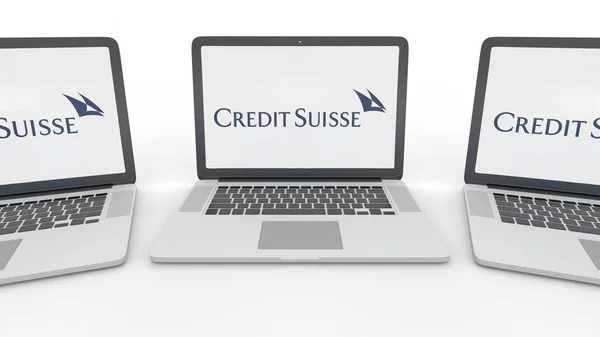 Notebooks with Credit Suisse Group logo on the screen. Computer technology conceptual editorial 3D rendering — Stock Photo, Image