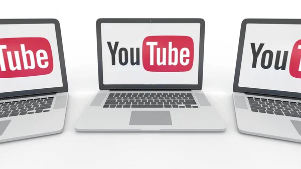 Anteckningsböcker med Youtube-logotypen på skärmen. Dator teknik konceptuella redaktionella 3d rendering — Stockfoto