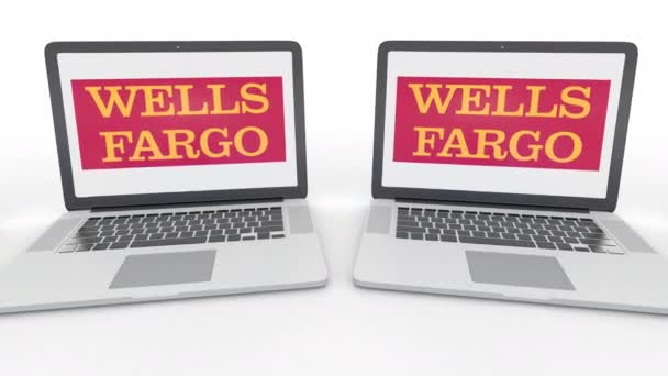 Σημειωματάρια με Wells Fargo λογότυπο στην οθόνη. Υπολογιστή τεχνολογία εννοιολογική συντακτική 4k κλιπ, αδιάλειπτη βρόχο — Αρχείο Βίντεο