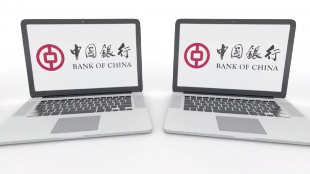 Notebooks com logotipo do Banco da China na tela. Tecnologia de computador editorial conceitual clipe 4K, loop sem costura — Vídeo de Stock