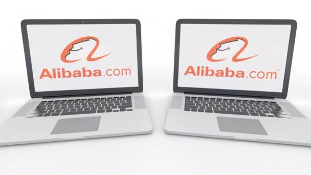 Laptops met Alibaba.com logo op het scherm. Computer technologie conceptuele redactionele 4k clip, naadloze loops — Stockvideo