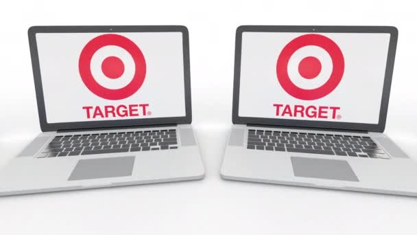 Cuadernos con el logotipo de Target Corporation en la pantalla. Tecnología informática editorial conceptual clip 4K, bucle sin costura — Vídeos de Stock