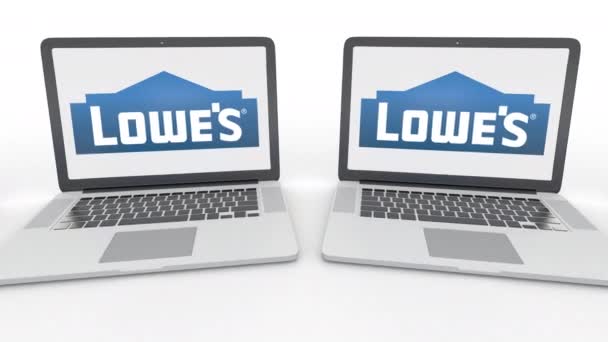 Laptops met Lowes logo op het scherm. Computer technologie conceptuele redactionele 4k clip, naadloze loops — Stockvideo