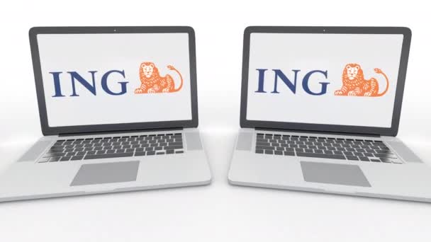 Notebooki z logo grupy Ing na ekranie. Komputer technologii pojęciowy redakcji 4k klip, Płynna pętla — Wideo stockowe